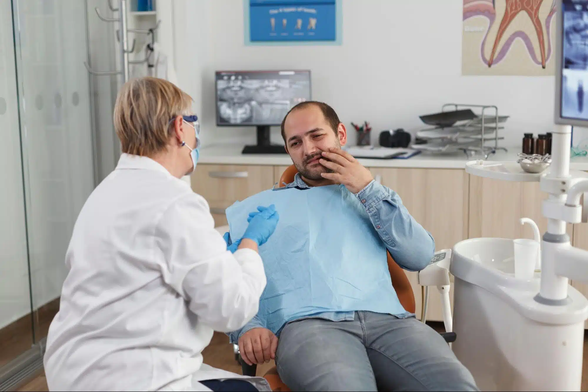 Oral surgeon explaining dry socket treatment after wisdom tooth extraction